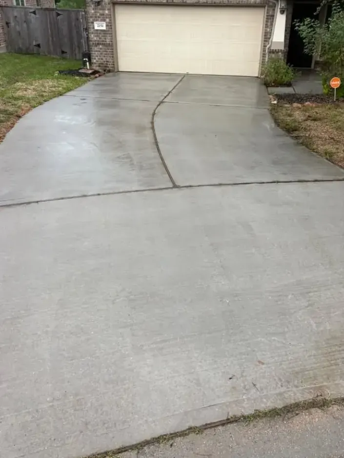 The same concrete driveway after cleaning