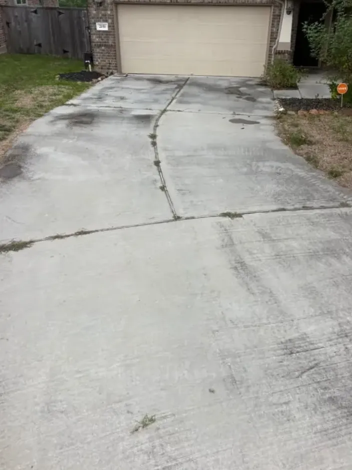 Stained concrete driveway before cleaning