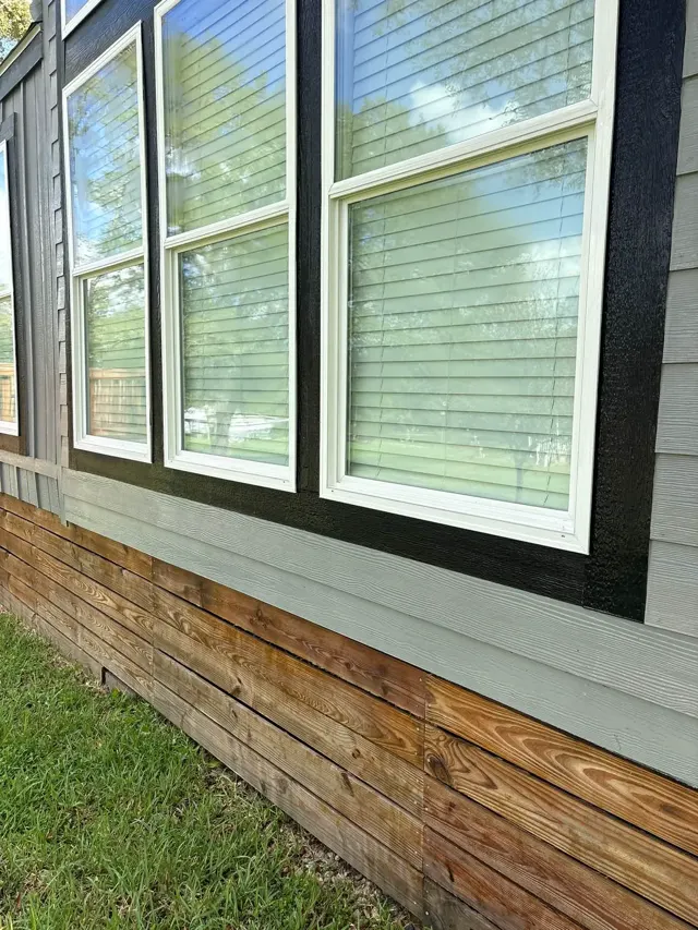 The same style of windows with clean white trim after washing